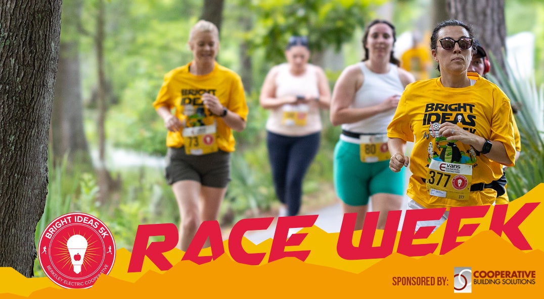 group of runners wearing yellow 5k shirts
