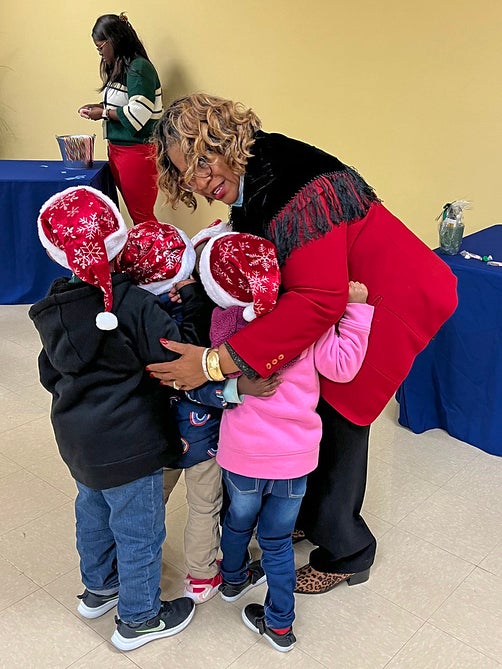 wire christmas lady hugging child