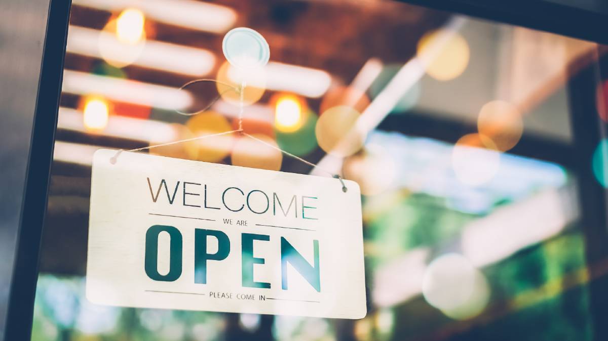 open sign in store window