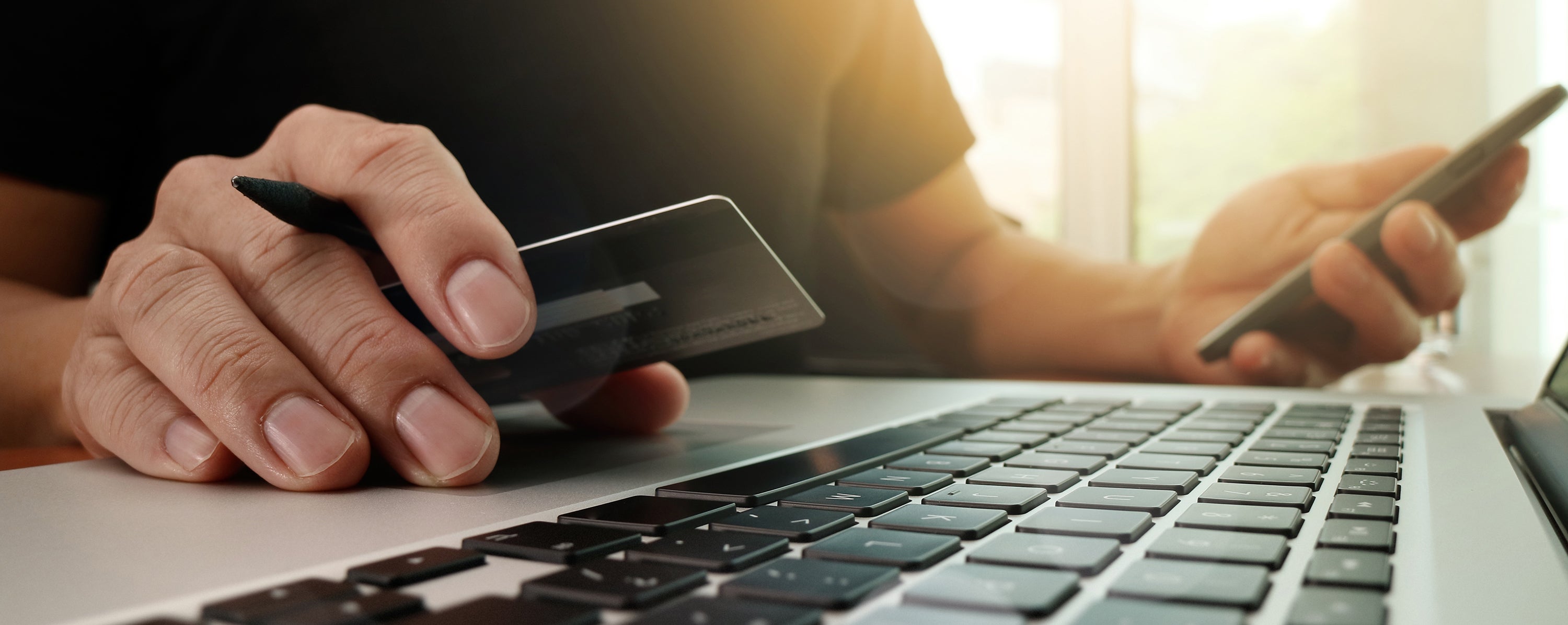man using laptop to make online payment
